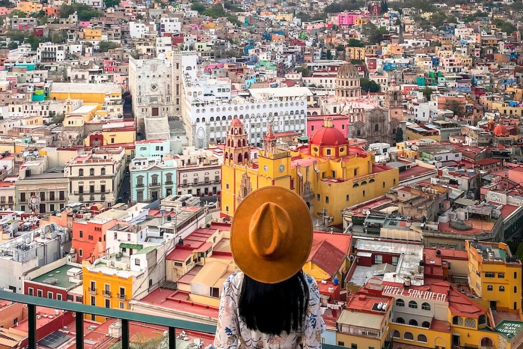 woman overlooking an old city in Mexico